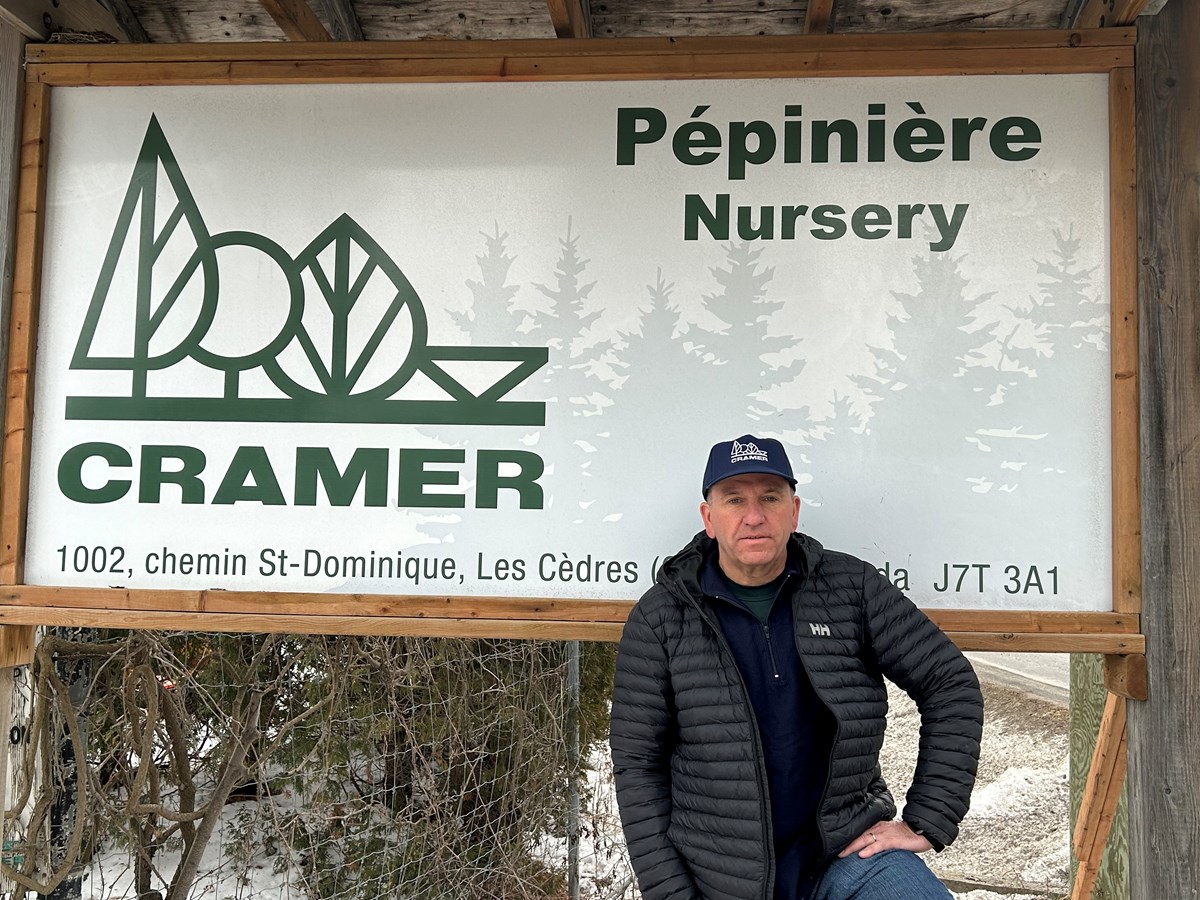 Mario Cramerstetter poses in front of one of the 22 entrances to the Cramer nursery in Les Cèdres