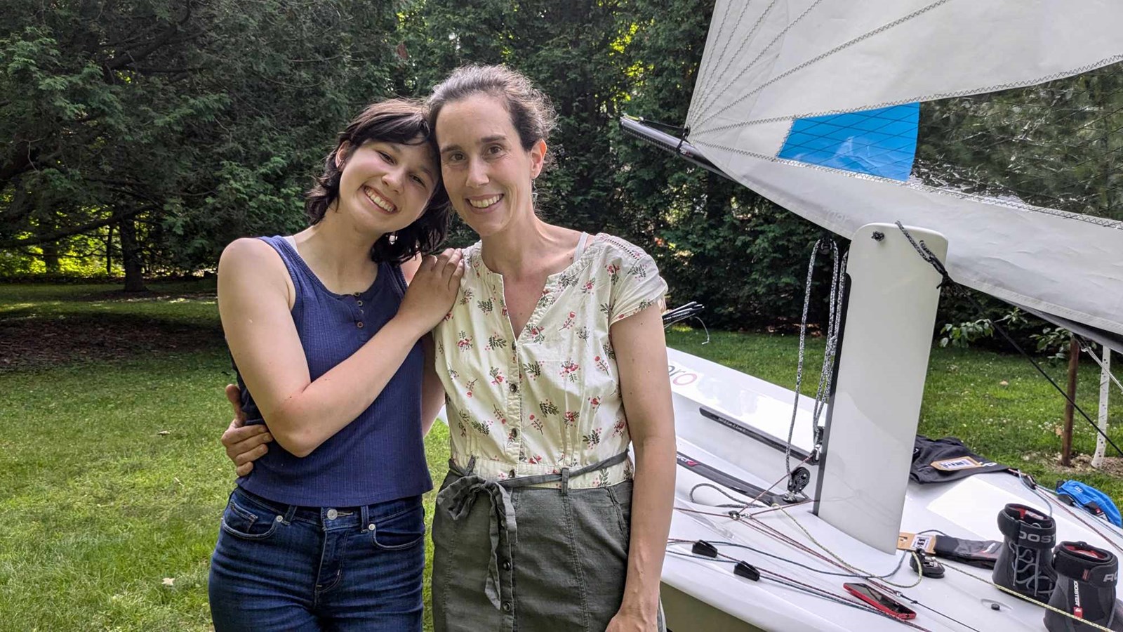 Florence, 15, poses with her mother Maude in front of her new sailboat